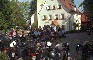 [Photo of attendees enjoying coffeeand pretzels in Doebel]