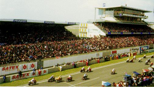 [Photo of the riders running across the track]