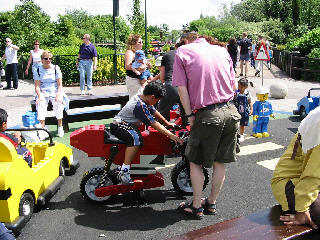 [McFrame kicks some kid off the lego bike]